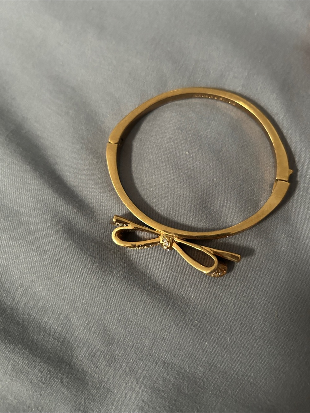 Kate Spade New York Hinged Pave Bow Gold Tone bangle